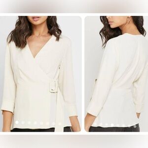NWT Topshop Wrap Blouse Belted Cream
Top size 10 BRAND NEW